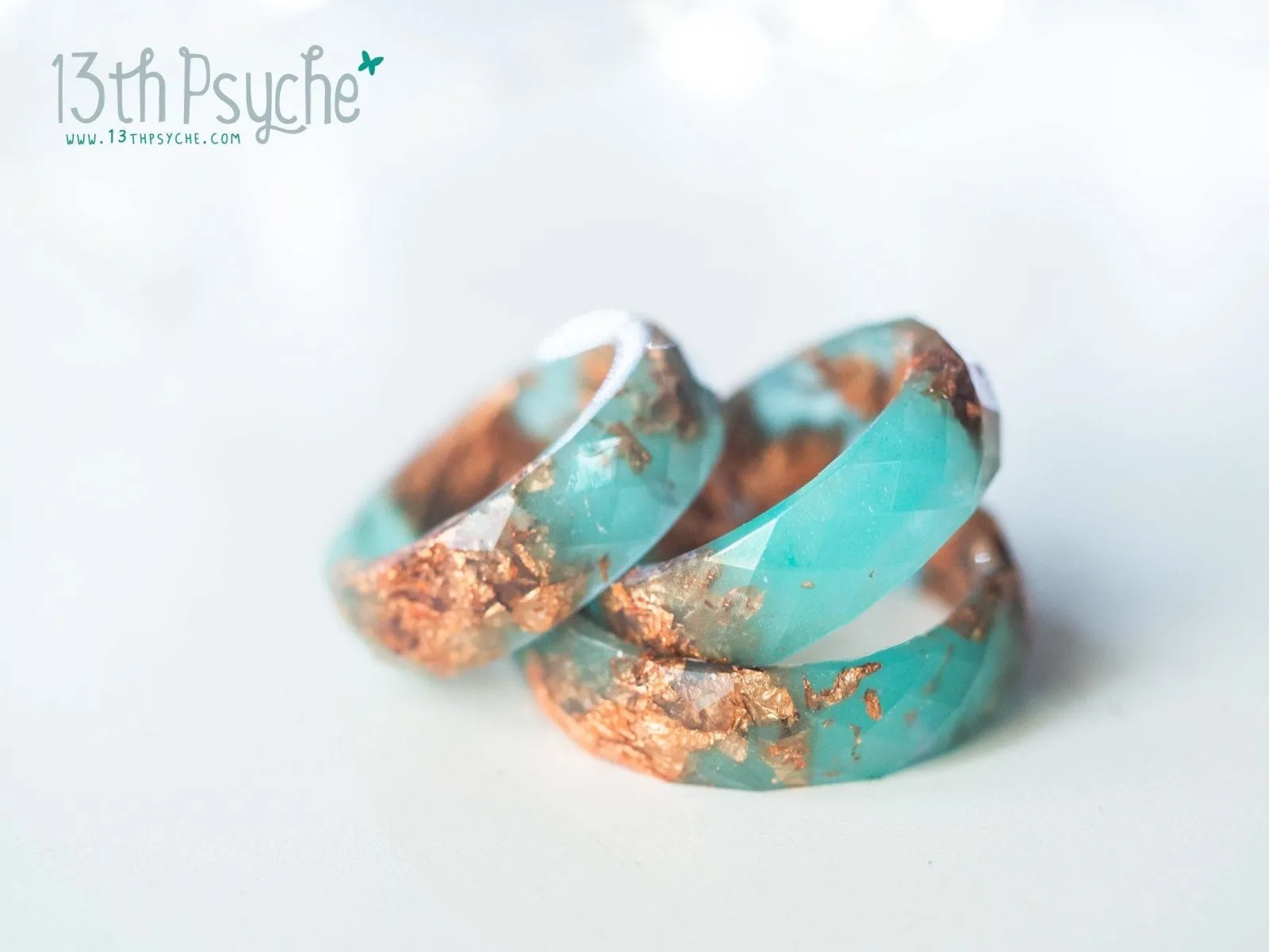 Aqua faceted resin ring with rose gold flakes