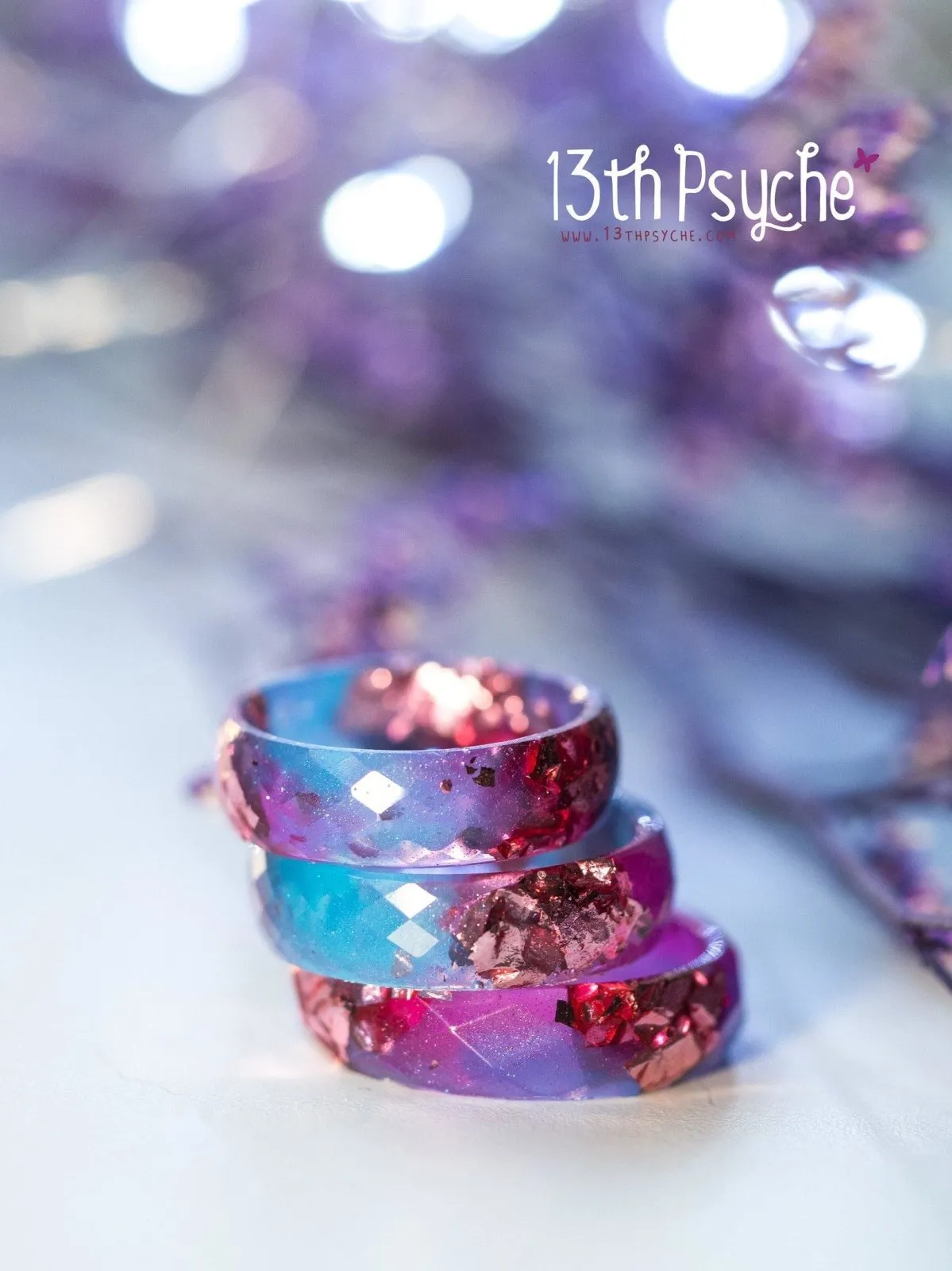 Blue and fuschia faceted resin ring with pink metallic flakes