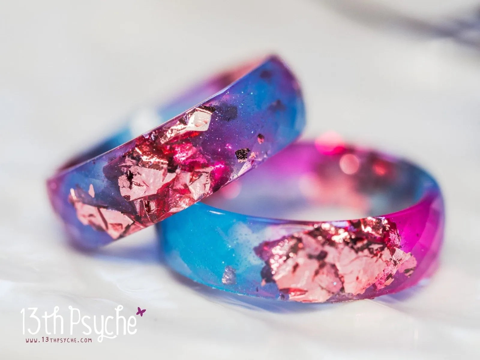 Blue and fuschia faceted resin ring with pink metallic flakes