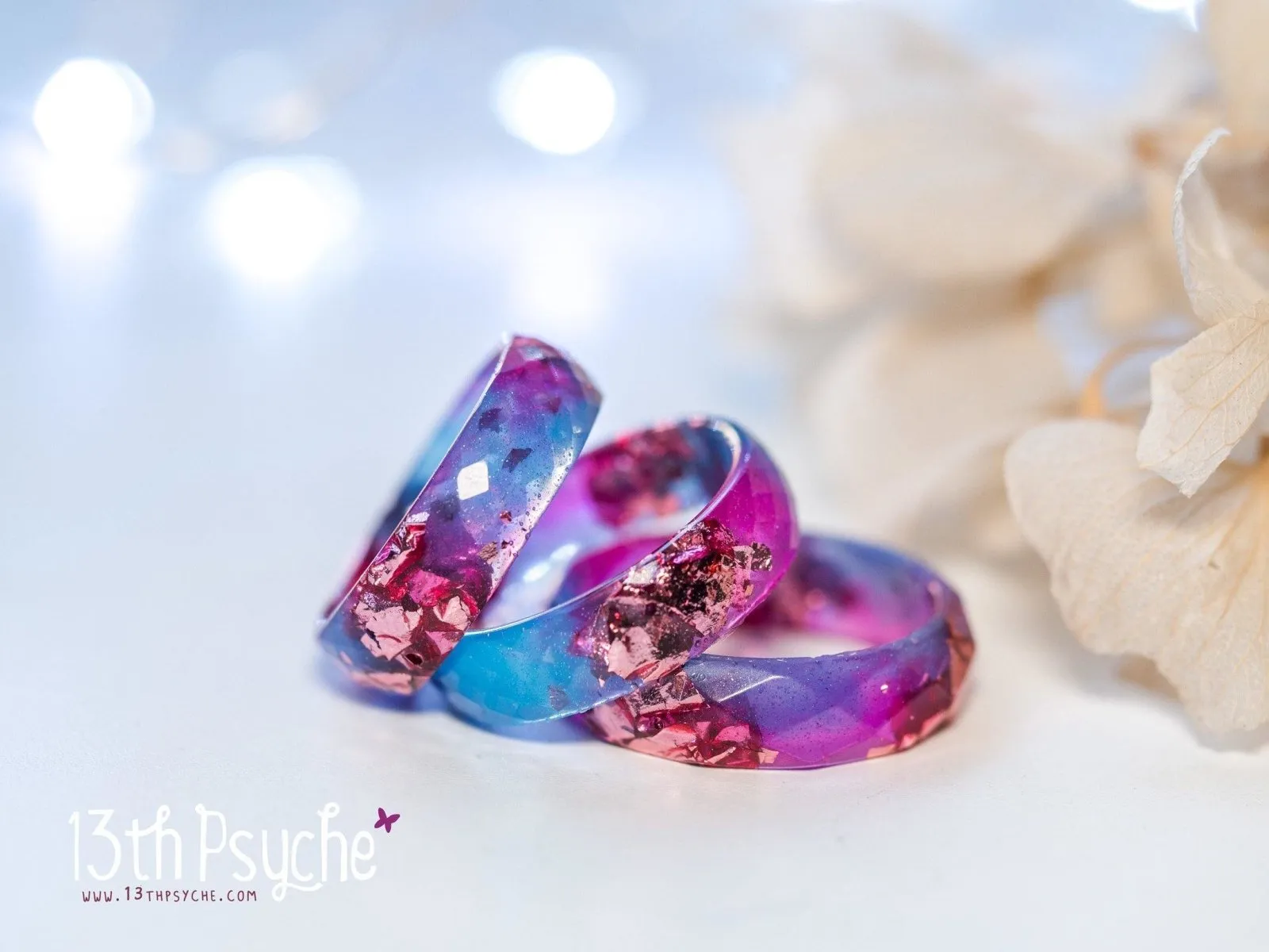 Blue and fuschia faceted resin ring with pink metallic flakes