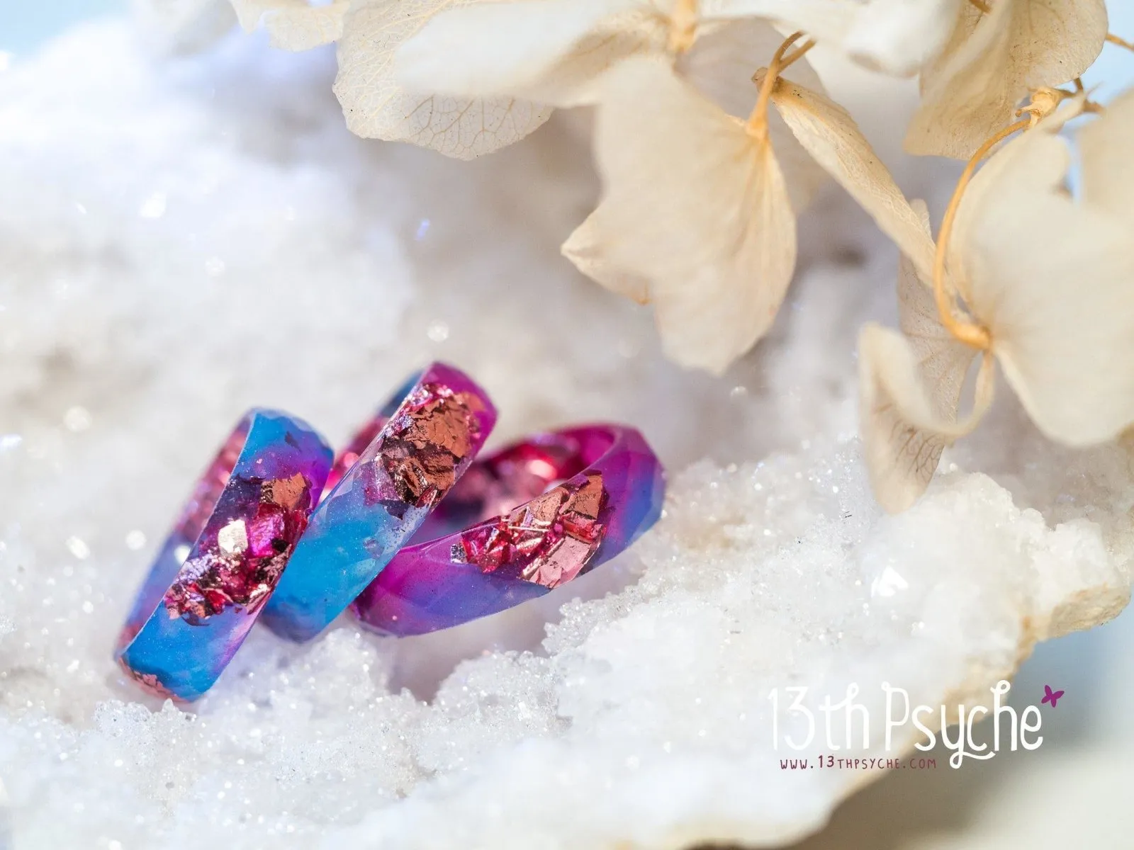 Blue and fuschia faceted resin ring with pink metallic flakes