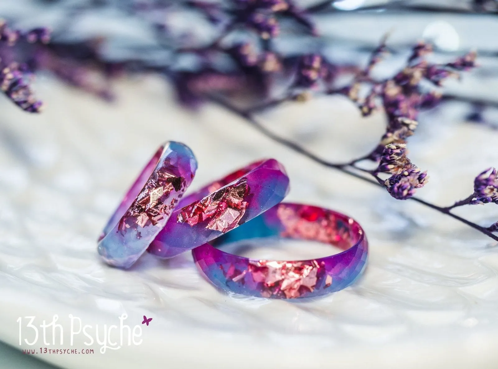 Blue and fuschia faceted resin ring with pink metallic flakes