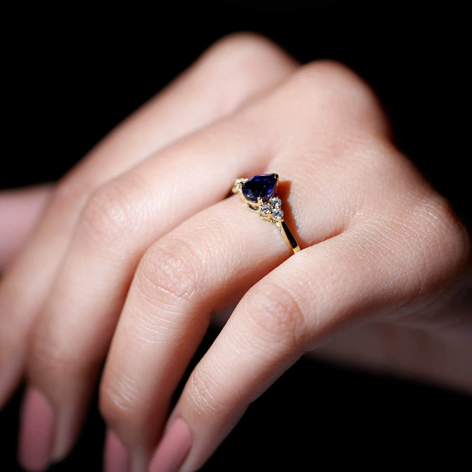 Pear Shaped Created Blue Sapphire Solitaire Ring with Diamond Trio