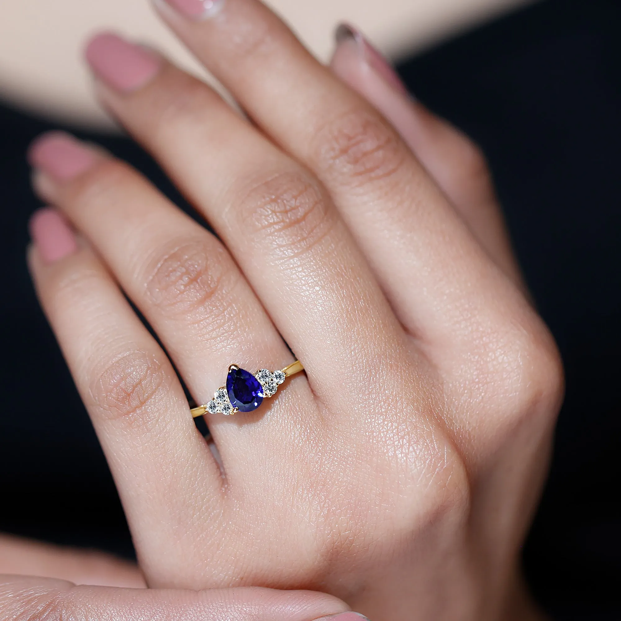 Pear Shaped Created Blue Sapphire Solitaire Ring with Diamond Trio